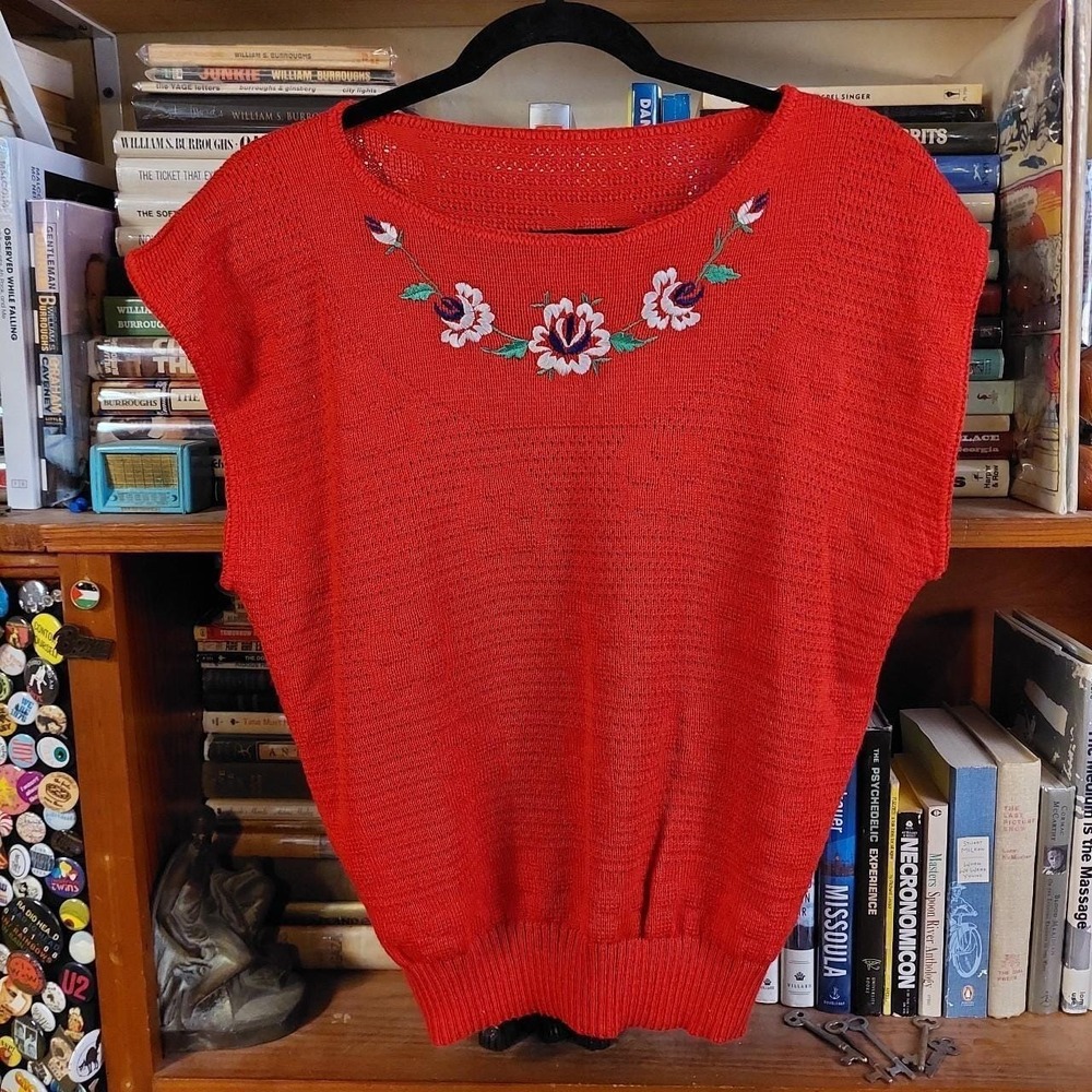 Vintage red floral sweater vest with floral embroidered detail.